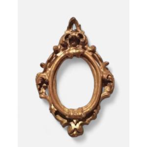 Cornice antica ovale dorata e intagliata Luigi XIV -Toscana XVII secolo