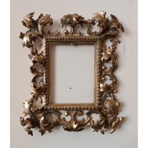 Antica cornice in legno intagliato e dorato ,cartoccio, Toscana XIX secolo