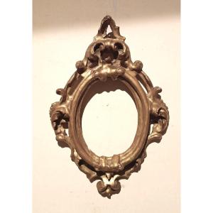 Cornice antica ovale dorata e intagliata Luigi XIV -Toscana XVII secolo 51x34 cm