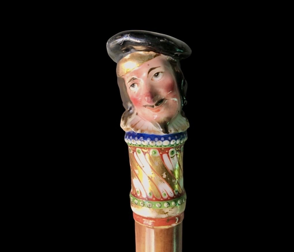 Bastone con pomolo in porcellana con figura maschile e canna in malacca.Nymphenburg,Germania,