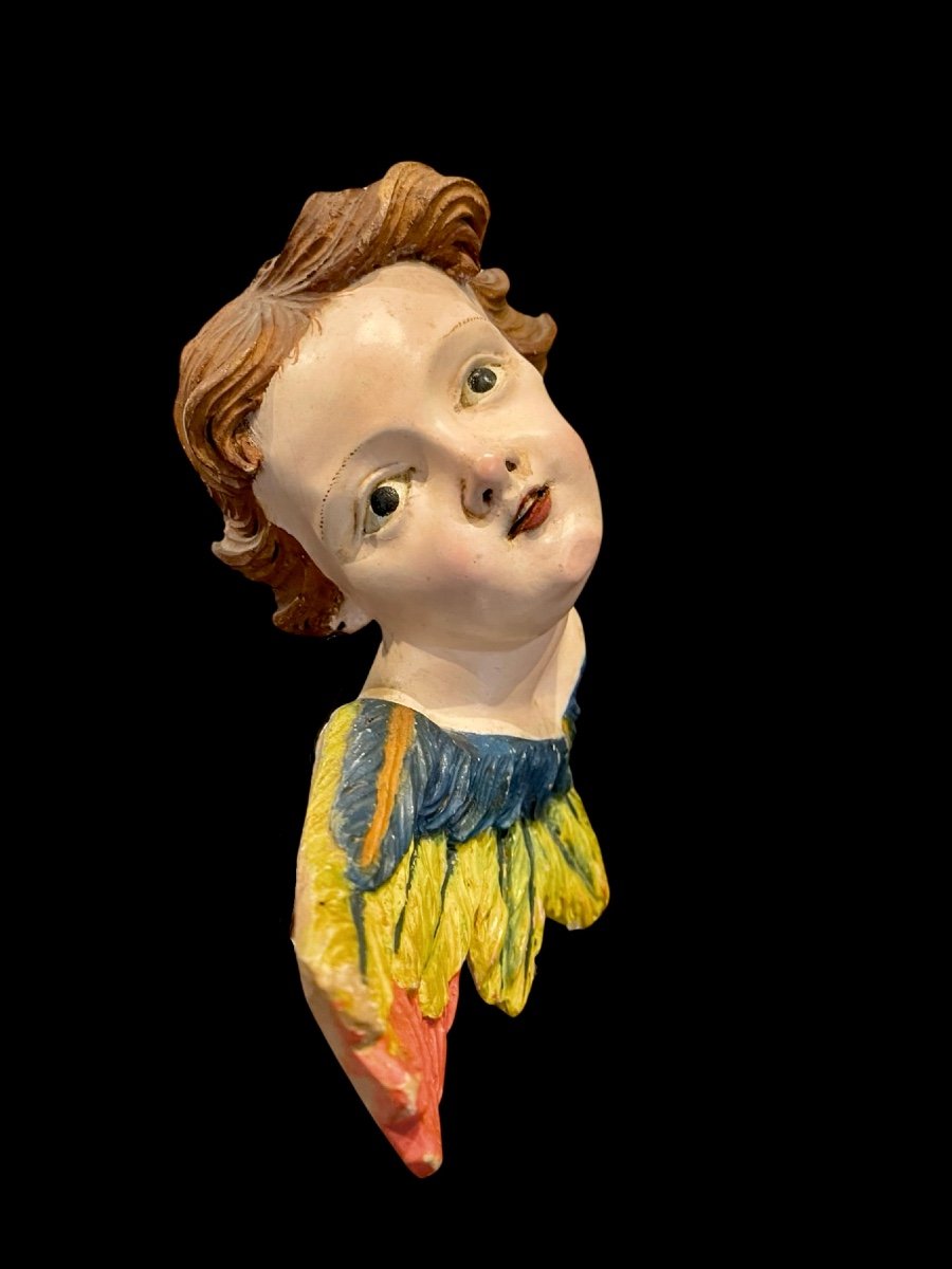 Angelo-cherubino in legno intagliato e dipinto. Liguria.