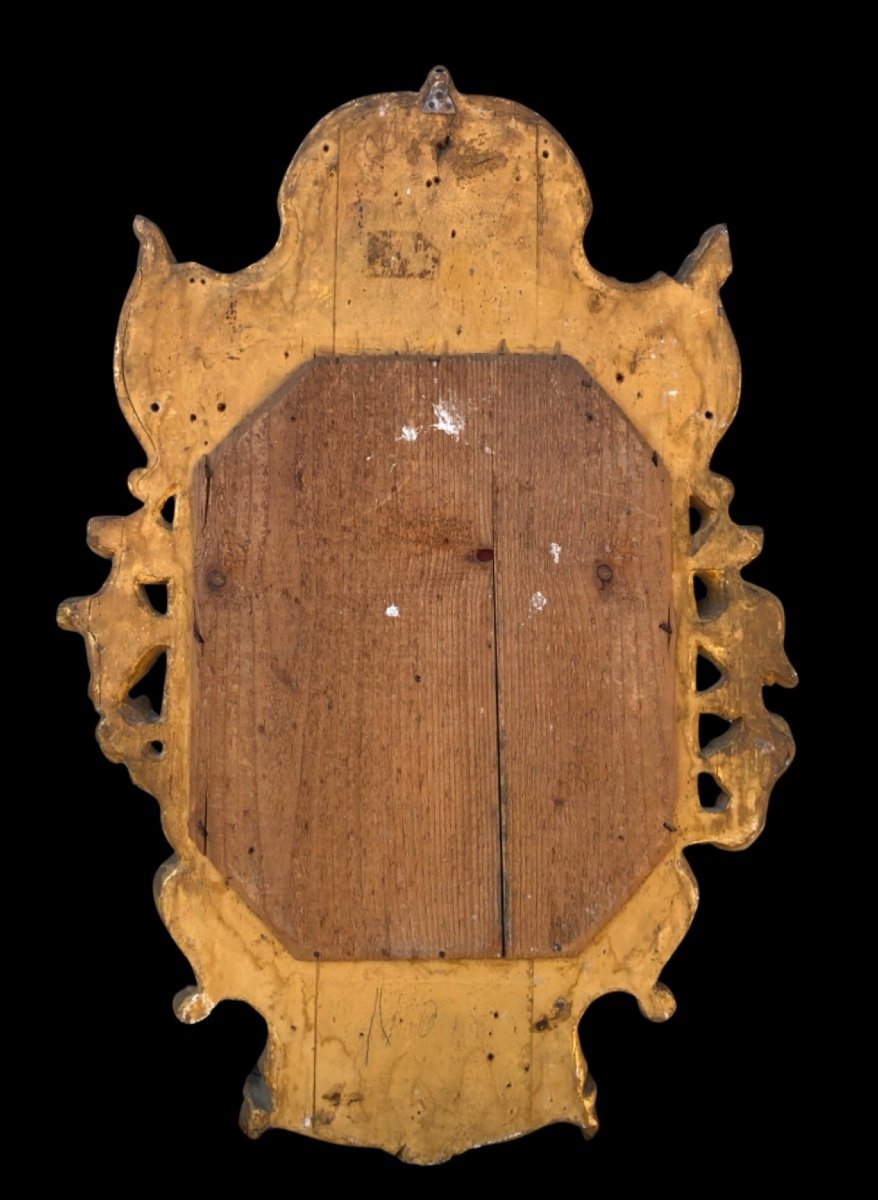 Cornice - specchiera in legno intagliato e dorato con motivi floreali e rocaille.-photo-1