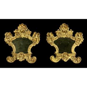 Coppia di cartaglorie in legno intagliato e foglia oro 