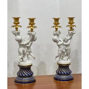 Pair Of Sèvres Porcelain Candlesticks In Biscuit And Gilt Bronze. 19th Century.