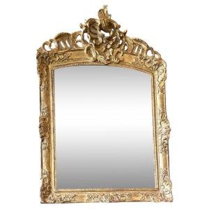 Miroir en bois sculpté et doré d’époque Régence 18ème