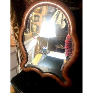Louis Philippe Mirror With A Scalloped Shape And A Rounded Satin Wood Frame With A Folding Base.