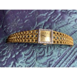 Exquisite Ladies' "omega" Gold Wristwatch With Rigid Links And A Square Dial Surrounded By Diamonds.