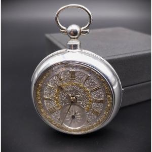 Orologio da tasca inglese in argento con splendido quadrante sbalzato, 1882.