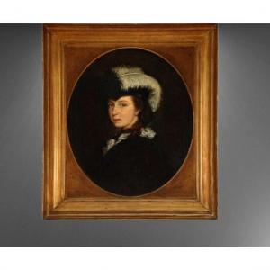 Portrait Of A Young Woman Wearing A Feathered Hat