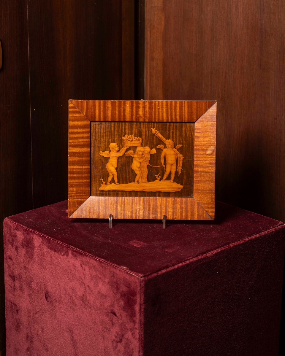 Tarsia lignea con figure di putti 