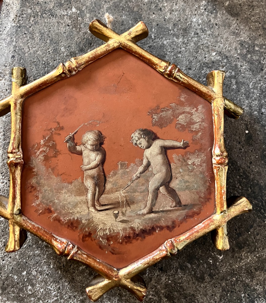 piccolo dipinto esagonale con scena di putti 