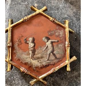 piccolo dipinto esagonale con scena di putti 