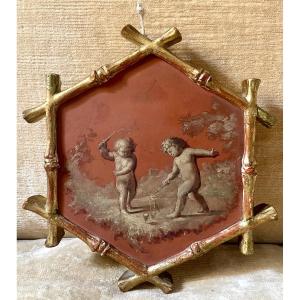 Piccolo dipinto esagonale con scena di putti 