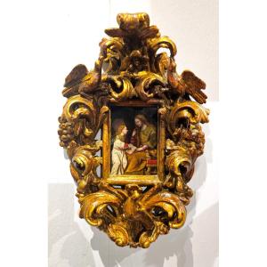 Dipinto su tavoletta entro cornice coeva raffigurante "Sant'Anna che educa la Vergine Maria"