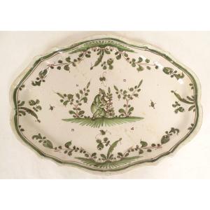Oval Earthenware Dish From Moustiers With A Figure, Flowers, And Foliage, 18th Century