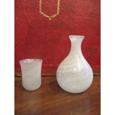 Small Water Carafe And Its Goblet Decorated With A White Filigree