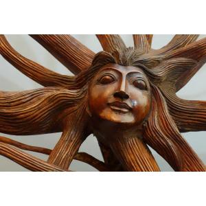 Sculpture Of Female Face With Radiant Hair.