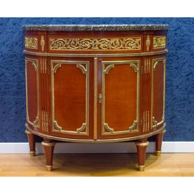 A Louis XVI Style Demi-lune Commode.