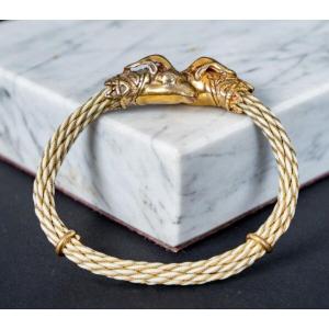 Gold Metal Bangle Bracelet Decorated With Two Roped Ram's Heads From The Early 20th Century