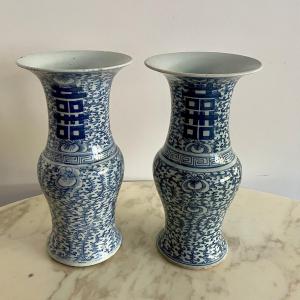 Pair Of Porcelain Vases Decorated In Blue With Scrolling Foliage And Chinese Characters.