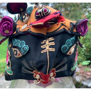 Chinese Ethnic Headdress On Silk Background And Embroidery