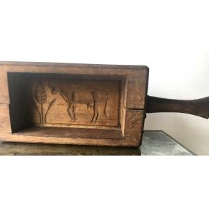 Large Cow Butter Brand At The Foot Of A Tree