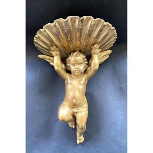19th Century Wall Stand. Cherub And Shell In Carved And Gilded Wood. 