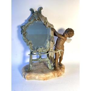 Tabletop Mirror On An Easel, Revealed By A Cherub. Patinated Metal And Marble, 19th .