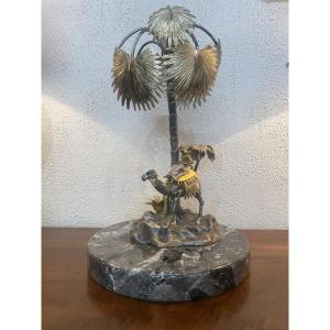 Sculpture Depicting A Camel Driver In An Oasis