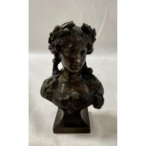 Small Bust Of A Young Woman Crowned With Flowers