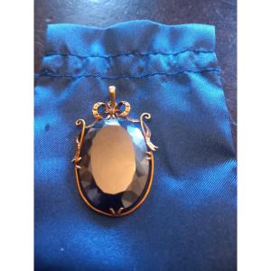 Yellow Gold And Blue Topaz Pendant.