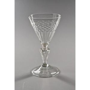 Molded Cup Glass With Rice Grain And Tab Shapes On A Grooved Hollow Stem. 18th Century