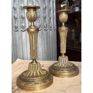 Pair Of Bronze Candlesticks In The Louis XVI Style.