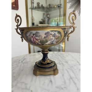 Sevres, In The Style. Enameled Porcelain Cup With A Blue Background Decorated With An Animated Scene 
