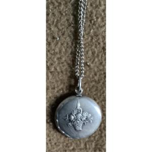 Silver Medallion Necklace Decorated With A Bouquet Of Flowers. 