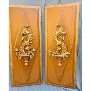 Pair Of Golden Wood Sconces On Painted Wood Panels