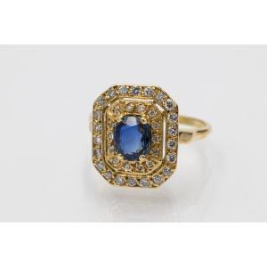 Unique Gold Ring With An Oval Sapphire And Diamonds.