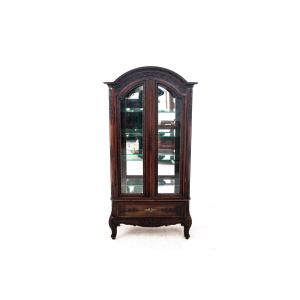 An Elegant Oak Display Cabinet With A Convenient Drawer At The Bottom.