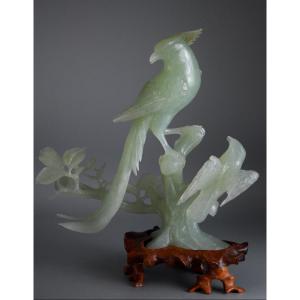 Celestial Elegance: Two Kings Of Birds Perched On A Flowering Branch