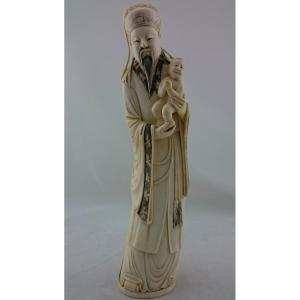 Statue Of A Chinese Sage With A Child