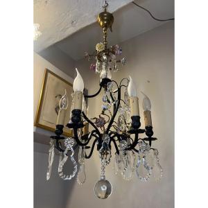 Old Chandelier Decorated With Flowers 