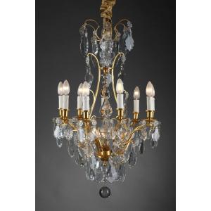 Chandelier With Eight Arms Of Lights In Gilt Bronze And Crystal Pendants