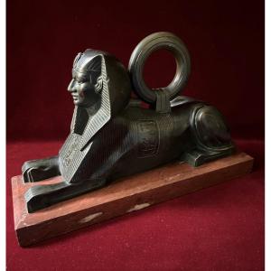 Bronze Sphinx On Red Marble Base