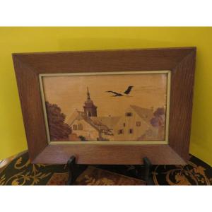 Charles Spindler (1865-1931) Marquetry On Wood, Bell Tower In Colmar And Flight Of Storks
