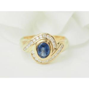 Yellow Gold Swirl Ring With Oval Sapphire And Diamonds