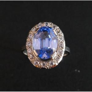 Ring Set With A Topaz Surrounding White Stones.