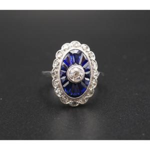 Art Deco Ring With Calibrated Diamonds And Sapphires, 18 Carat Gold.