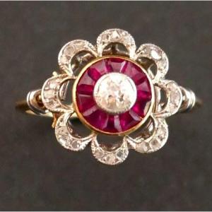 Ring Decorated With A Diamond, Surrounded By Calibrated Rubies.
