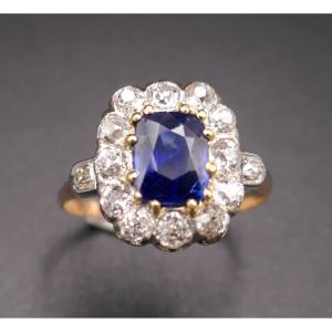 Ring Decorated With A Sapphire And Diamonds, Gold And Platinum.