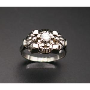 Ring Adorned With A Diamond, 18 Carat White Gold.